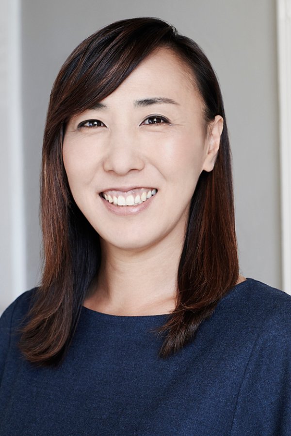 Portrait of smiling woman in blue t shirt