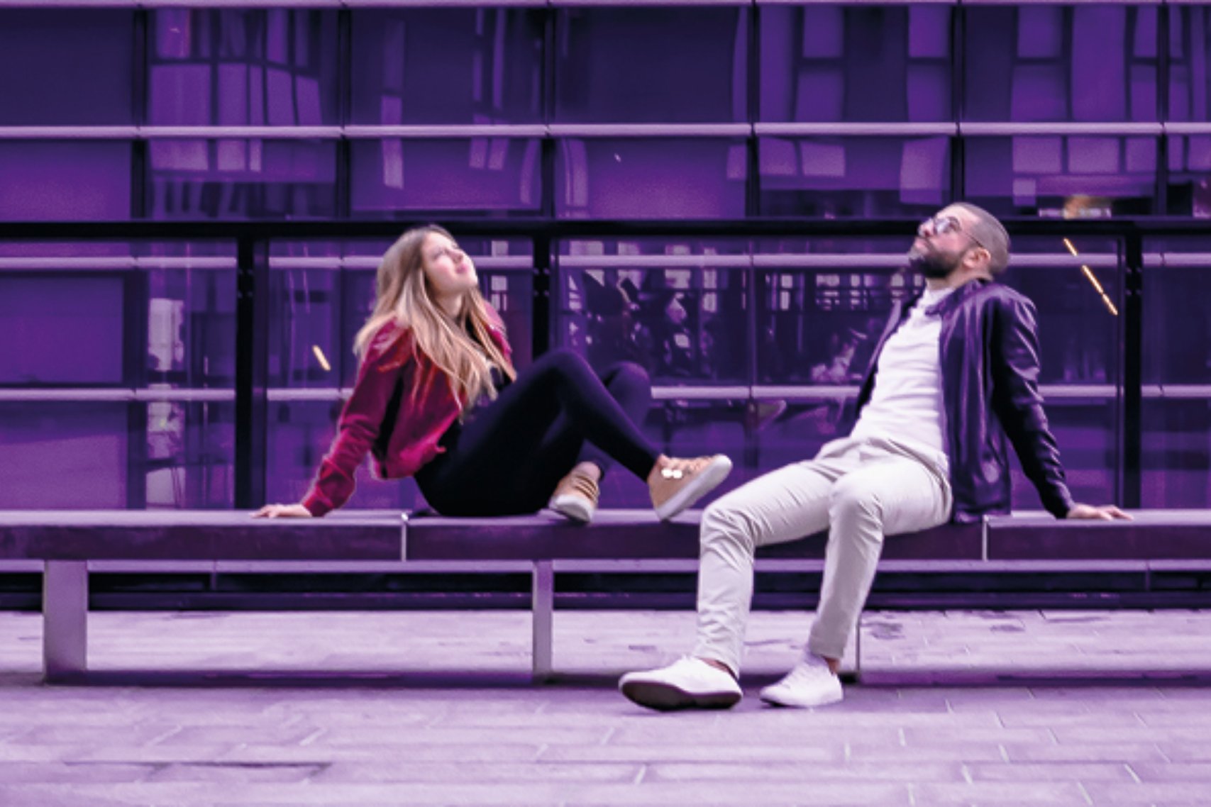 A man and a woman looking up the sky