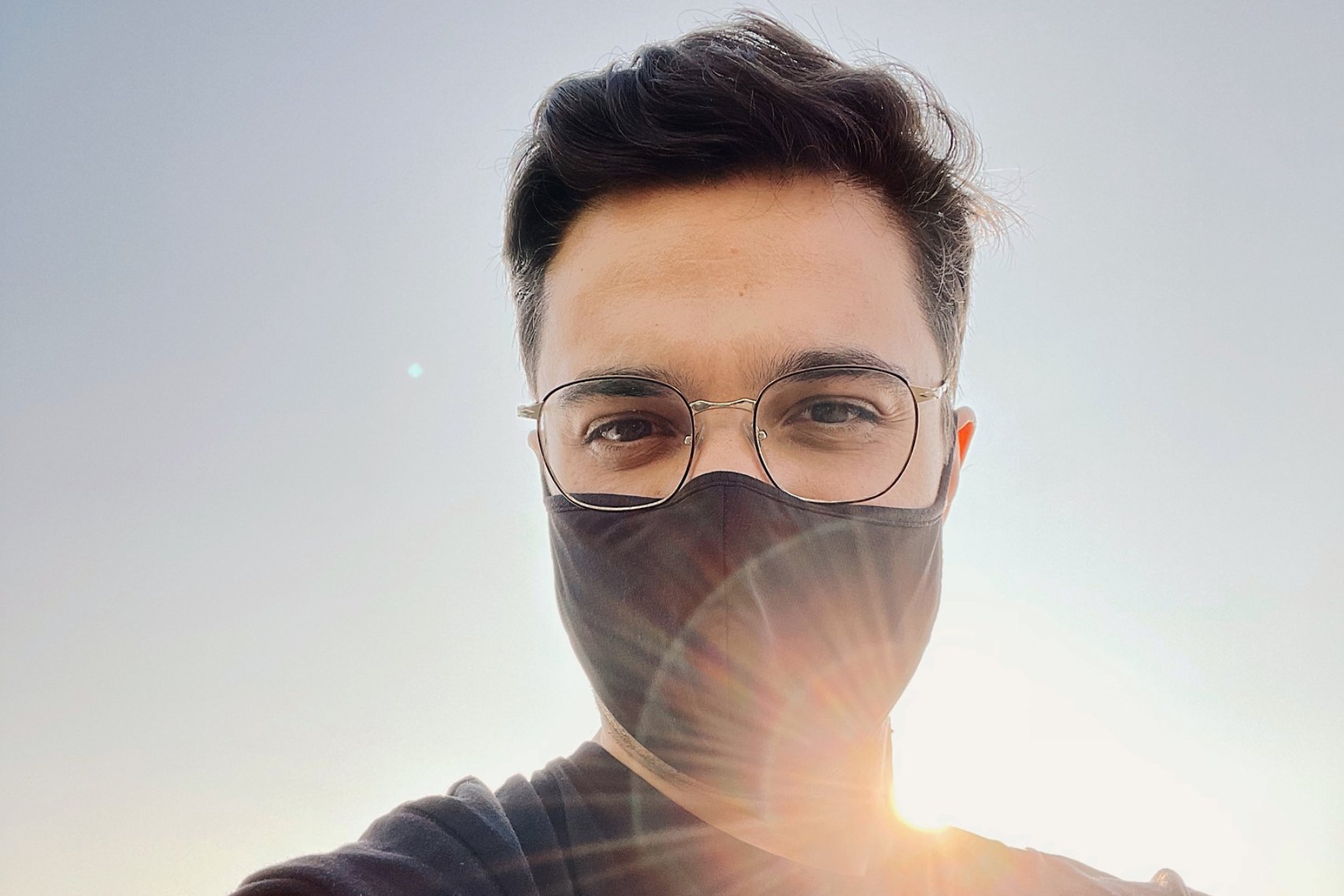 A guy wearing black shirt and black facemask