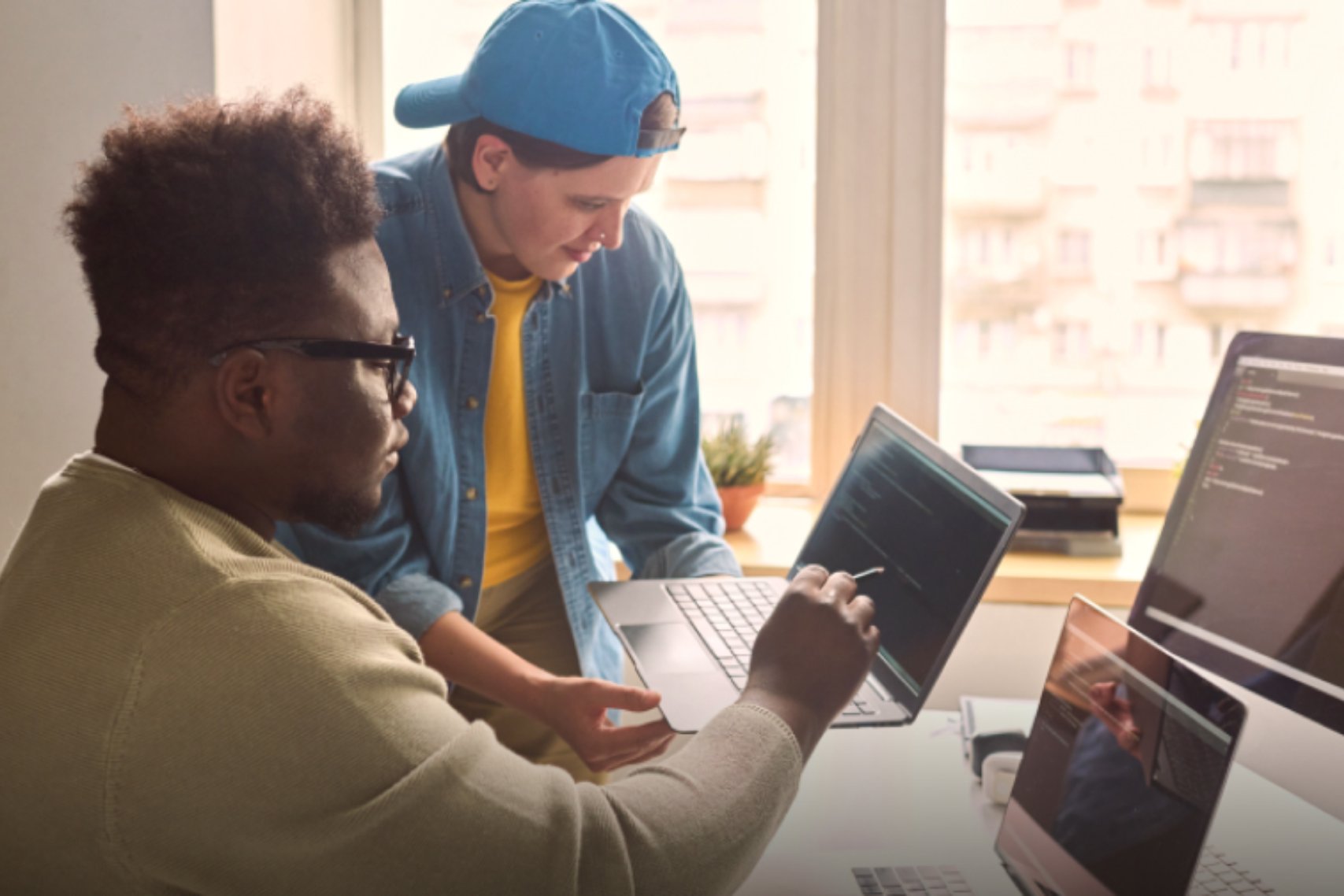 Two men co working in a desk
