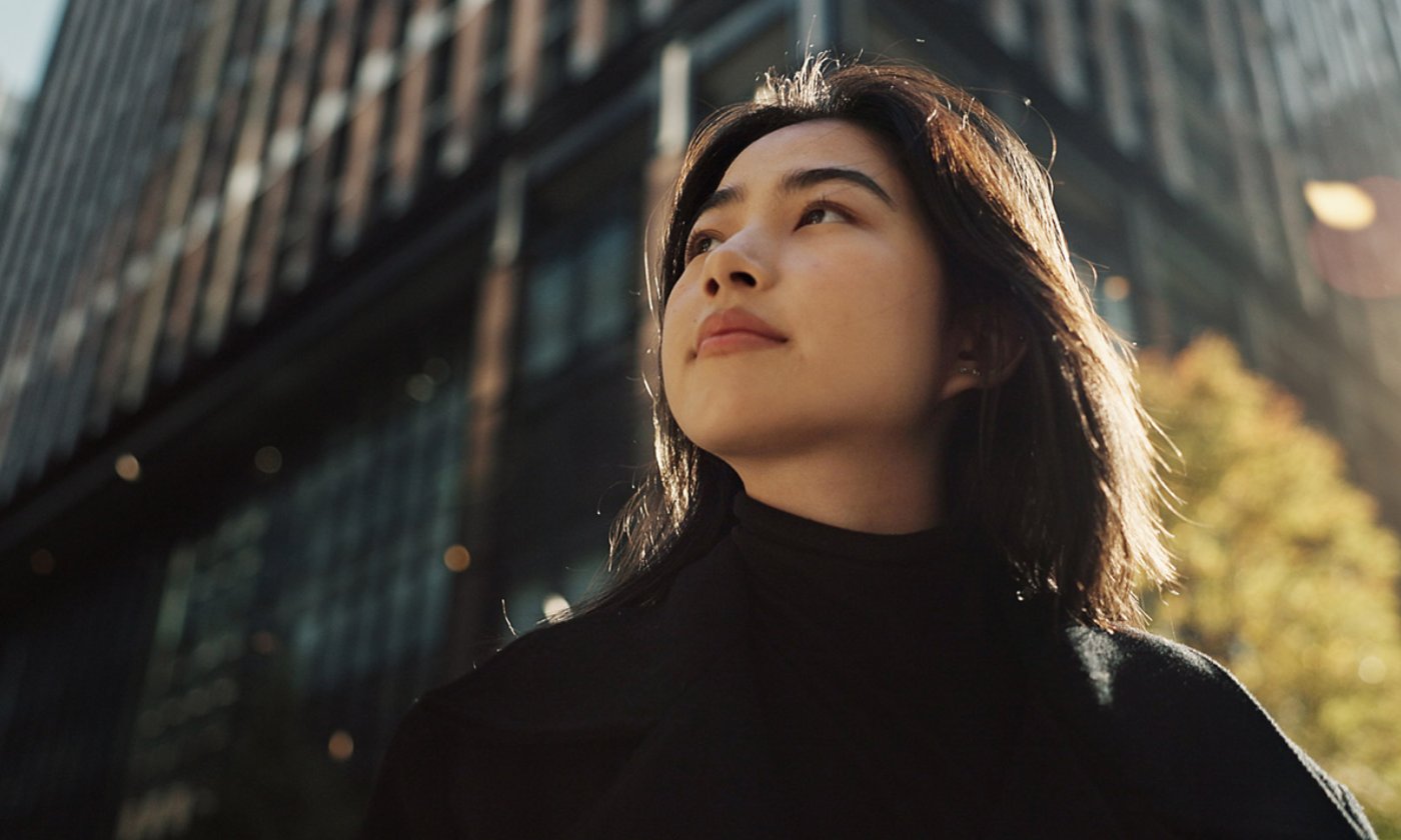 A woman in front of the building