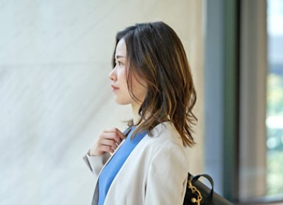 A woman looking at the window.