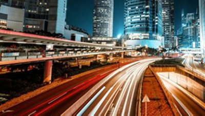 Hong Kong night city view with bridge, buildings and cars