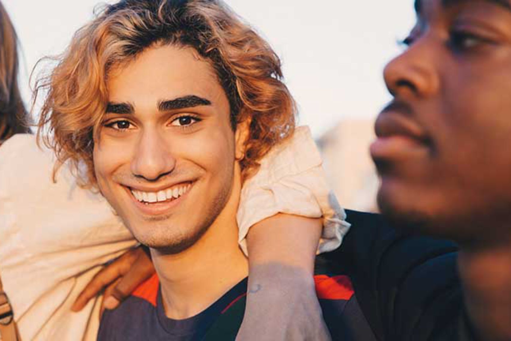 Man smiling with friends