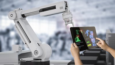 A white robotic arm and a tablet