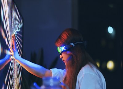 Woman wearing augmented reality glasses touching the screen with hands 1 760x551 JPG