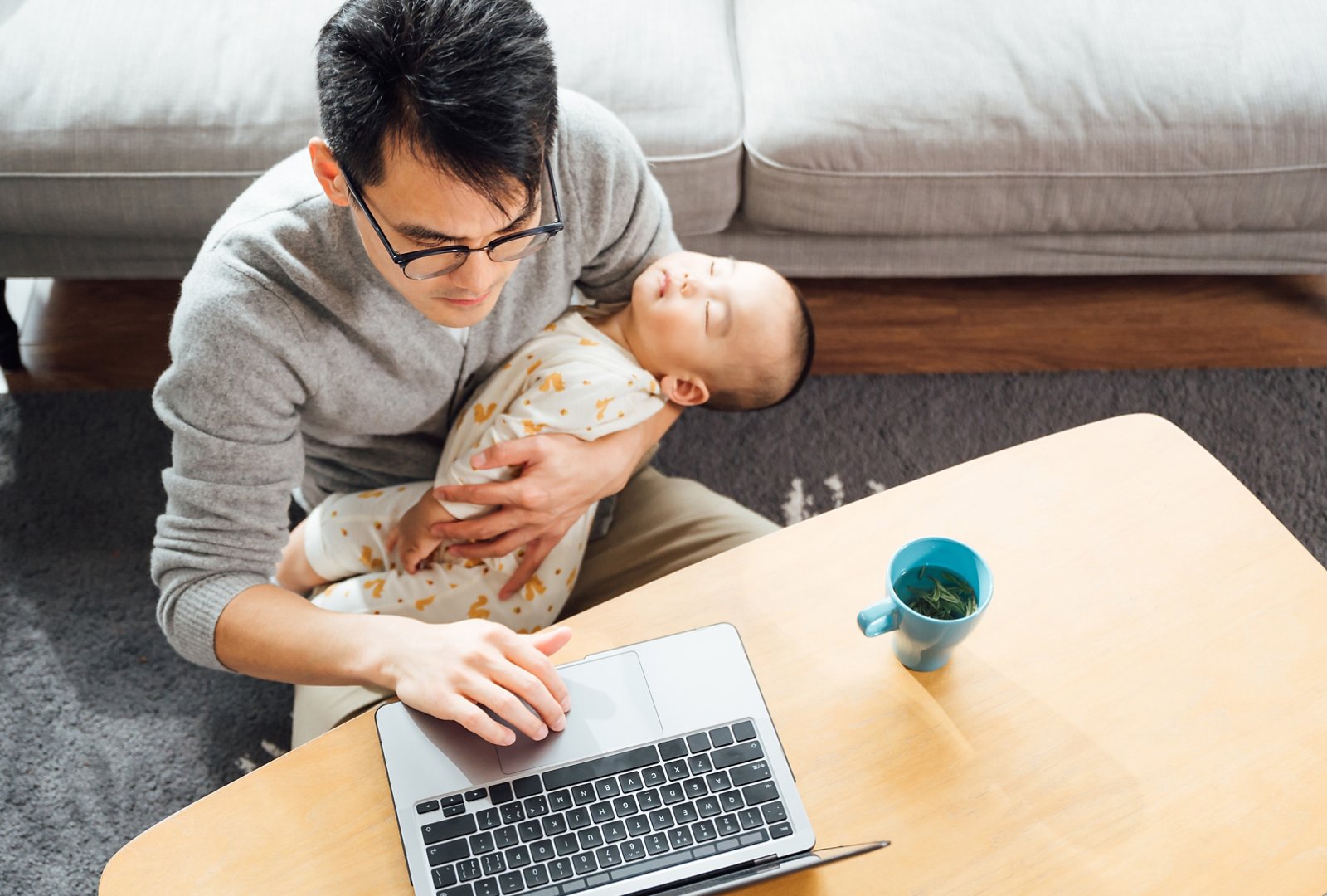 working while holding baby