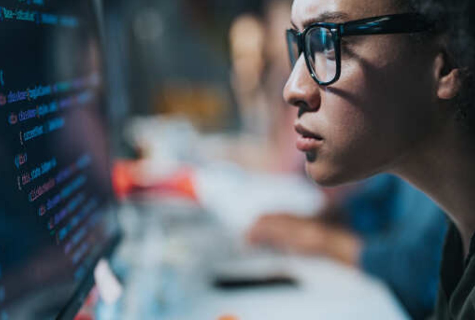Woman with glasses typing