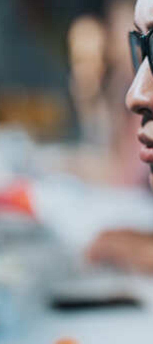 Woman looking on the code on screen