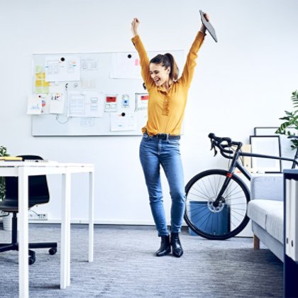 Girl dancing at the office, cheer