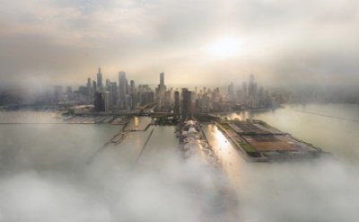 The image shows a city skyline with skyscrapers and buildings