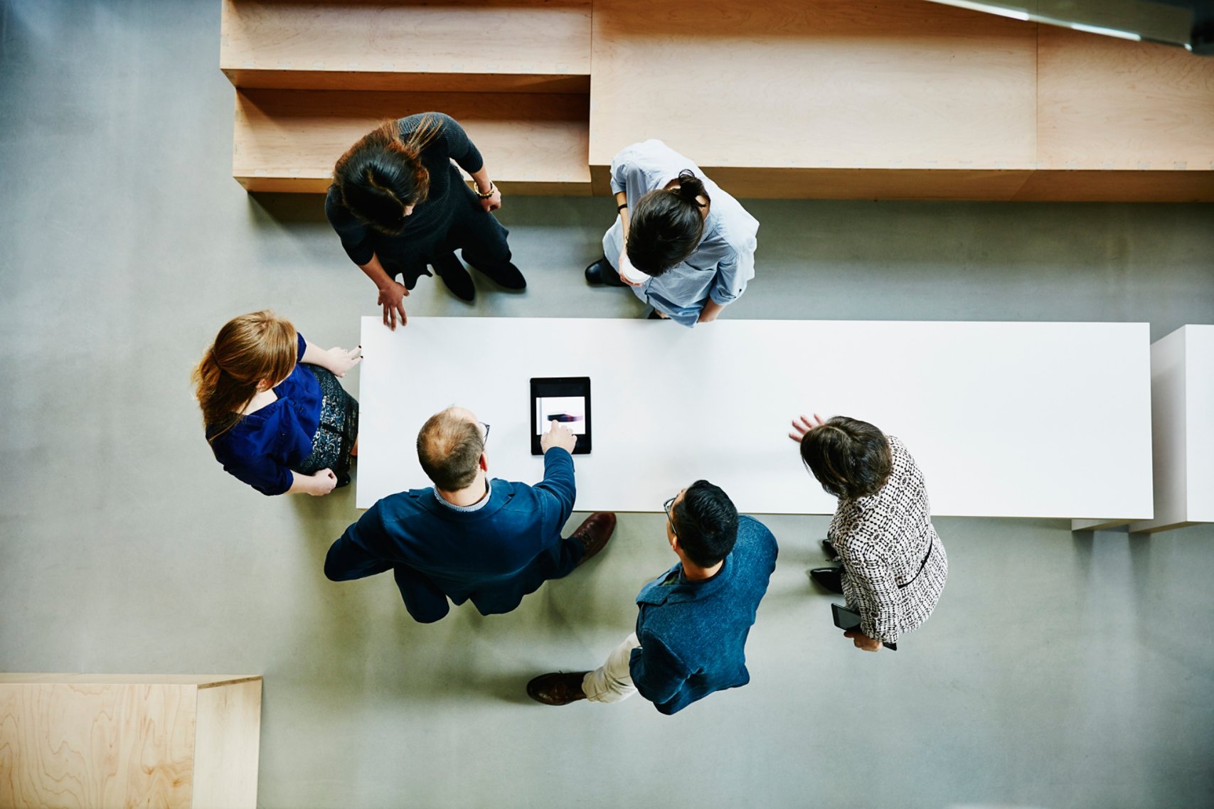 Image of six people discussing something