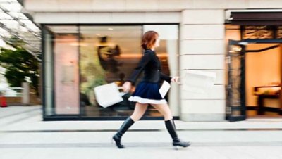 woman walking on the street with blur background