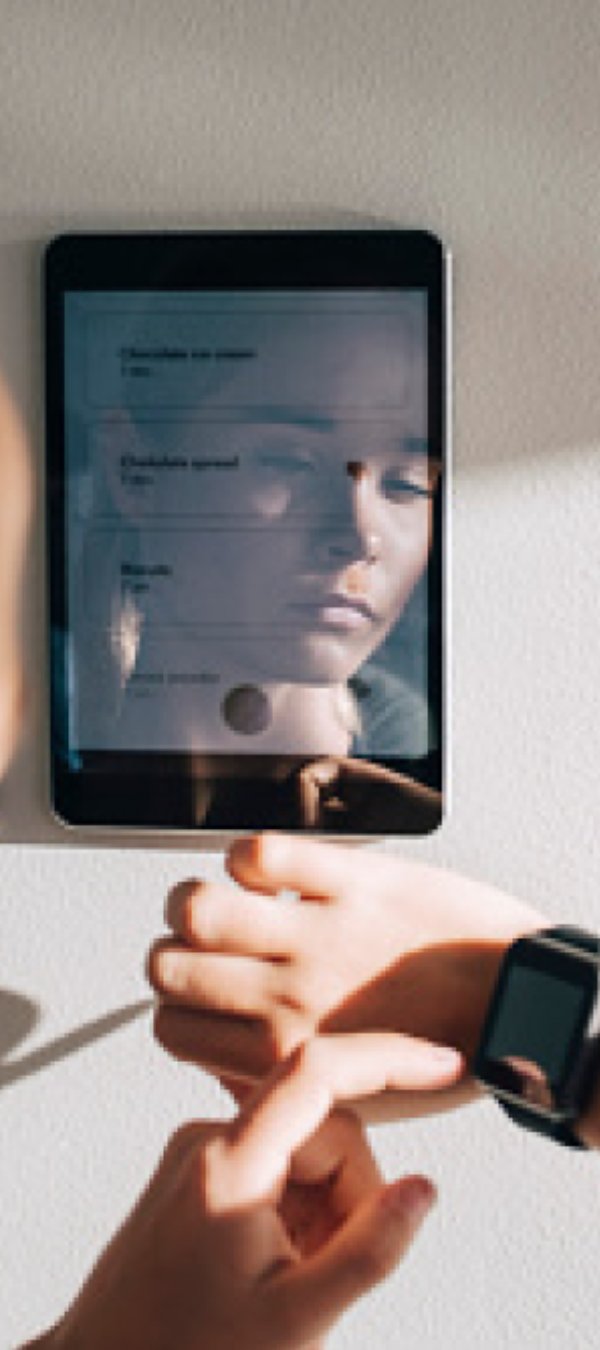 A woman looking at her smartwatch