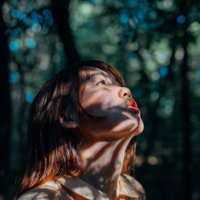 Woman Under Forest Light