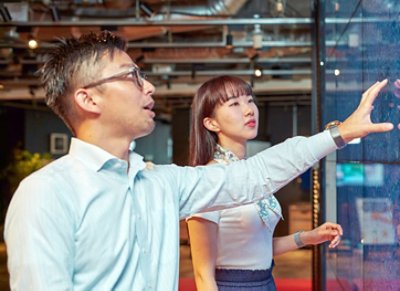 Two Young Man and Woman Having a Disussion in the Office 724x525 JPG