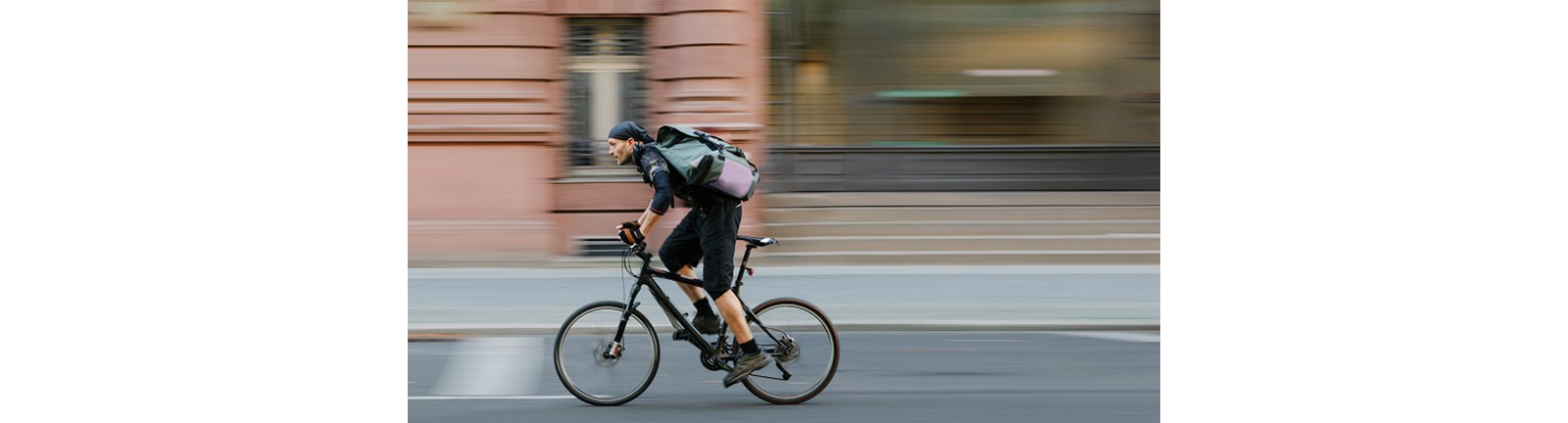 Bike Messenger Riding In City