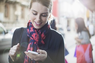 Women Looking in Her Mobile Phone 724x480 JPG