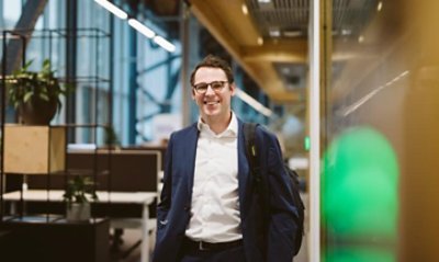 Man walking towards camera smiling