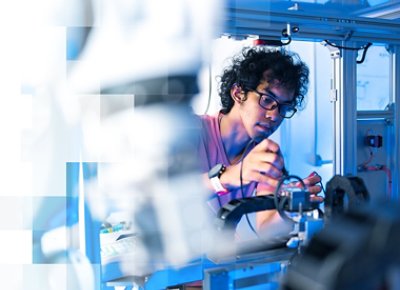 Engineer fixing some part of a robotic structure