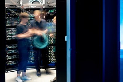 blurred people inside data center