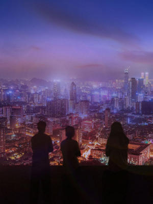 Silhouette of three people and the city lights view