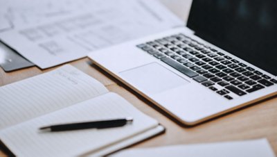 Desk with Open Notebook Laptop