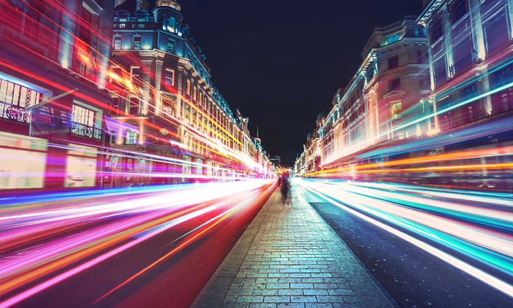 Person walking down path in Urban setting with time lapse