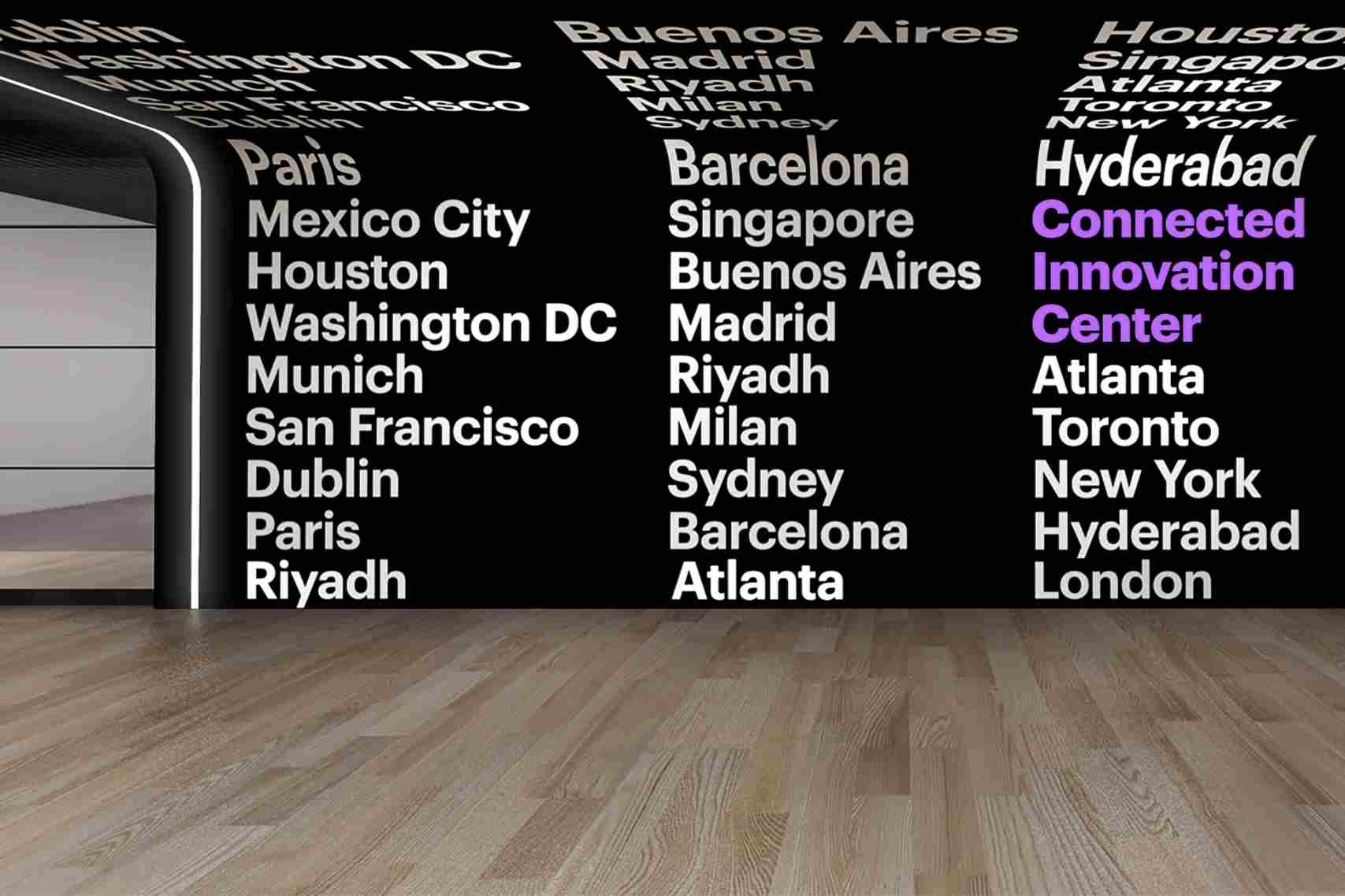 Image of a room with lights reflecting off the wall with city names.