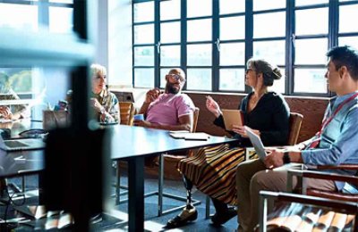 Four people sitting while discussing