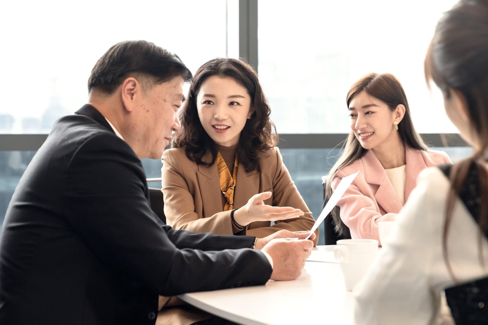 Four people in a meeting