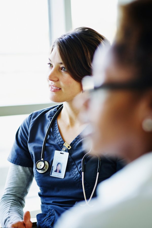 Doctor holding stethoscope in both hands