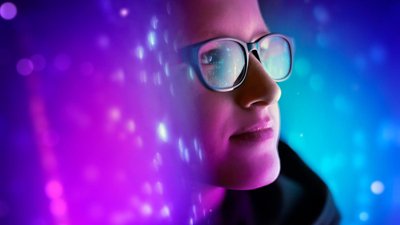 Woman in glasses with purple background