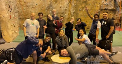 A group of Wellington-based analysts and consultants going rock climbing after work