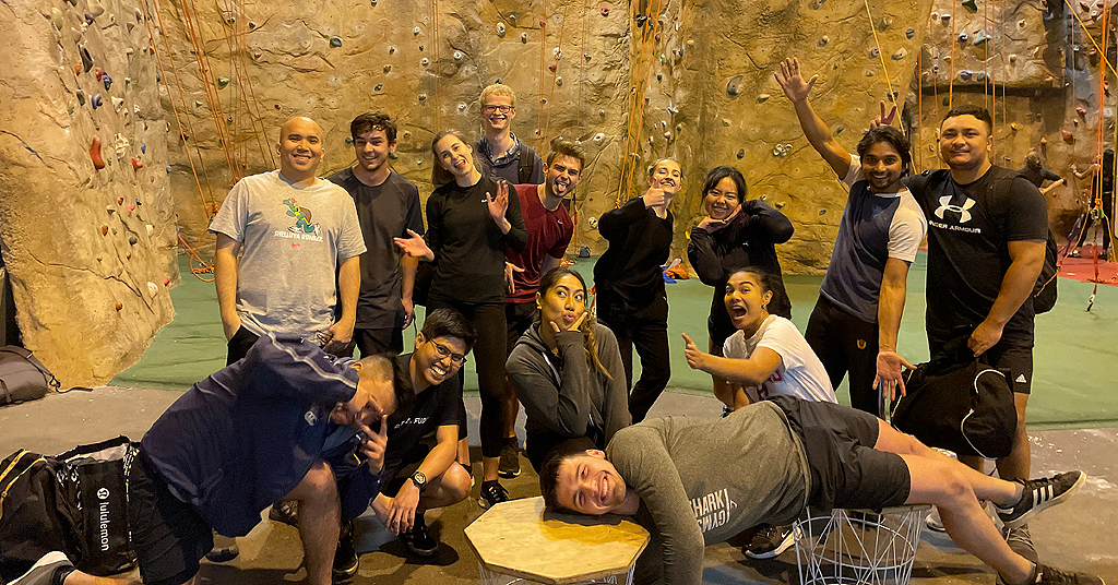 A group of Wellington-based analysts and consultants going rock climbing after work