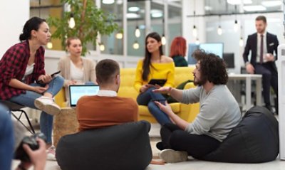 Agroup of people sitting in a room discussing