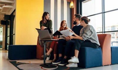 A group of people talking in lobby couch