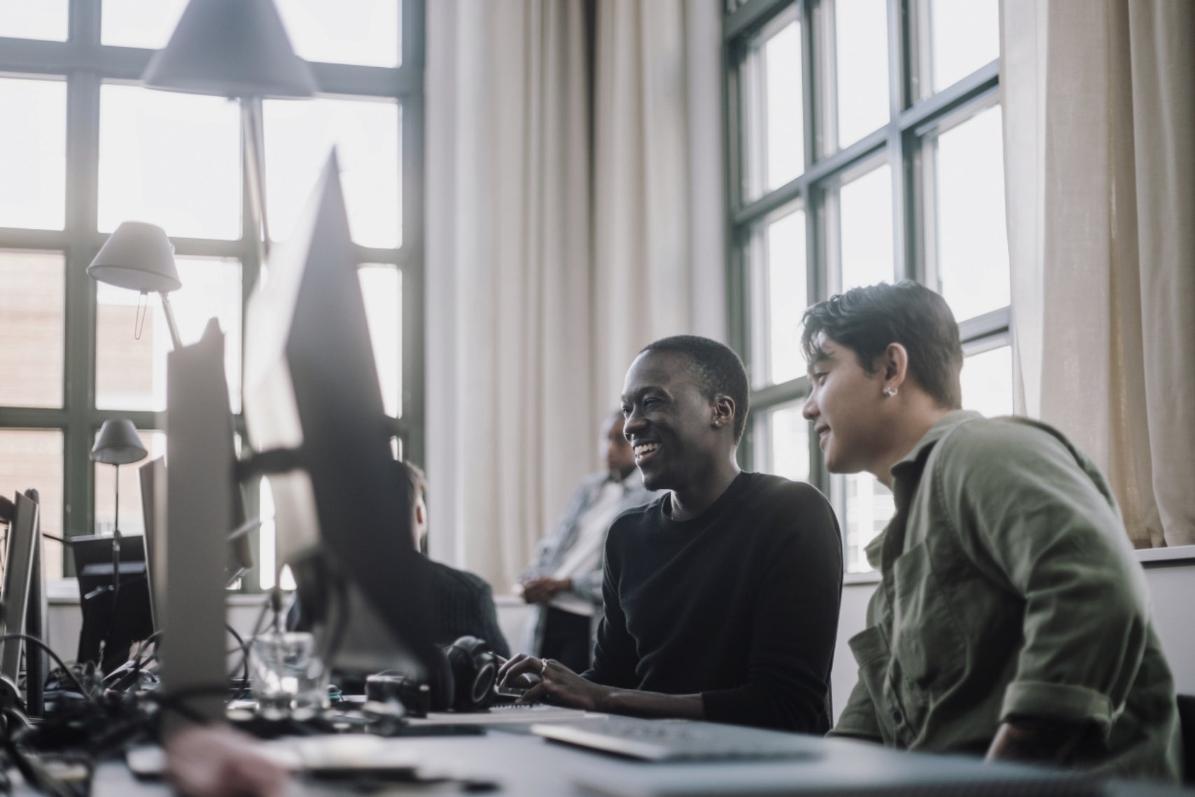 Two guys looking at a computer