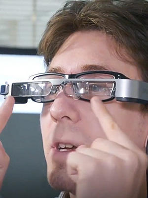 Man looking through smart-caption glasses