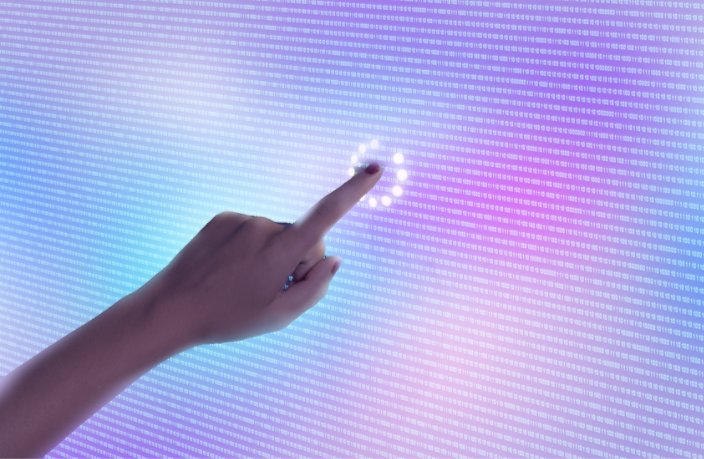 Finger touching digital screen