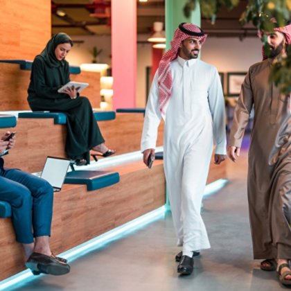  Modern office lounge with Middle Eastern professionals