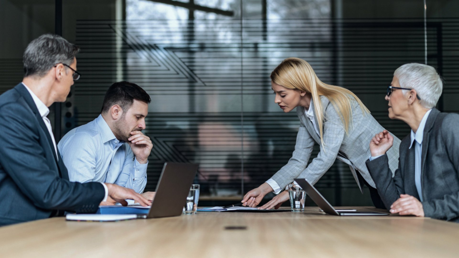 People in Meeting Looking at Documents