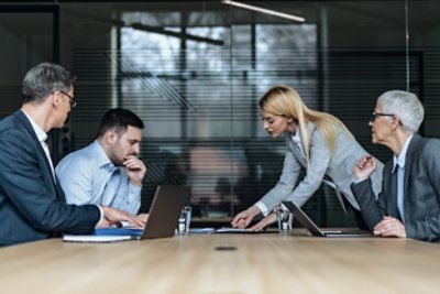 People in Meeting Looking at Documents