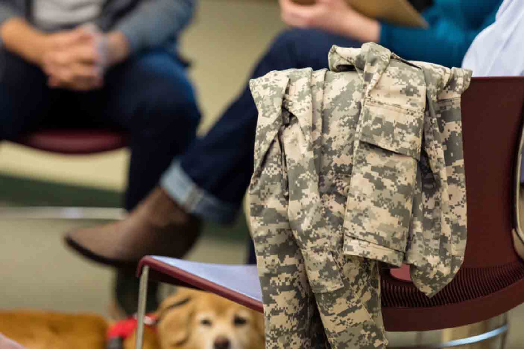 Military jacket hanging on chair