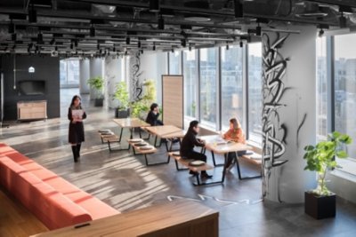 People in a lobby like a coworker space 