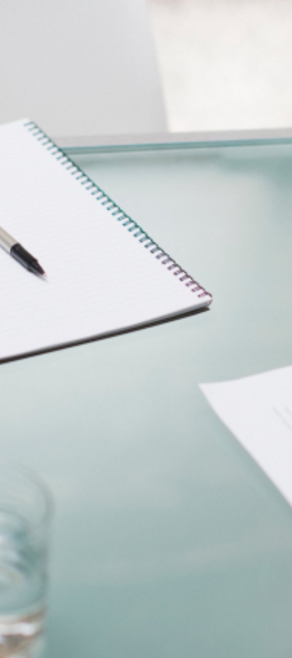 Pen and paper on desk