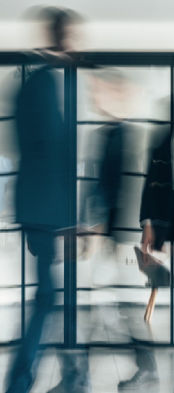 Busy modern workplace. Working process in the office, business people working, walking and talking, blurred motion