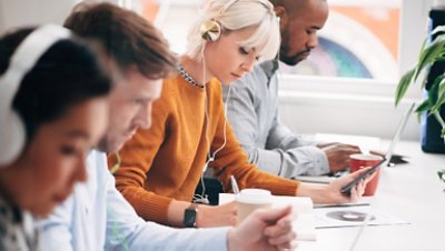 Four people listening audio training