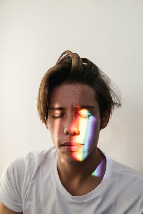 Man with rainbow on his face