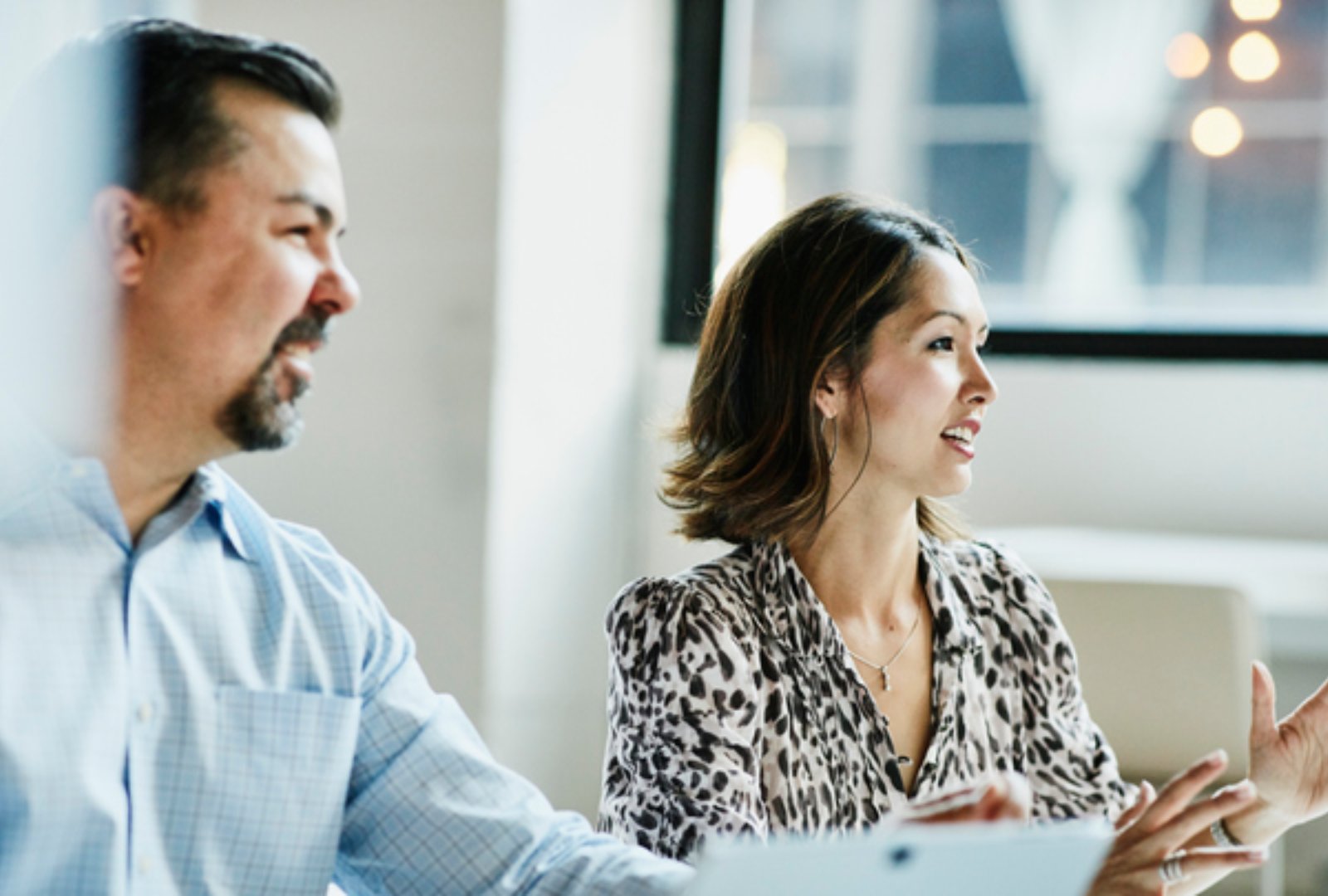 Businesswoman leading team meeting in coworking office